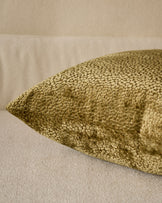 Harlene cushion in medium olive green, close-up detail showing textured woven fabric surface.