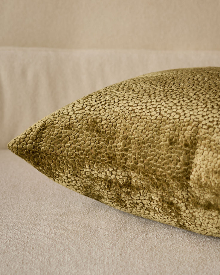Harlene cushion in medium olive green, close-up detail showing textured woven fabric surface.