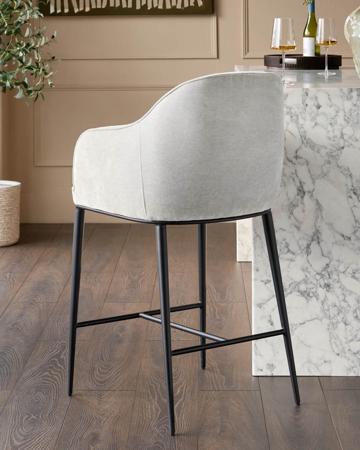 Harley bar stool in natural grey fabric with black metal legs and footrest, shown at marble counter.