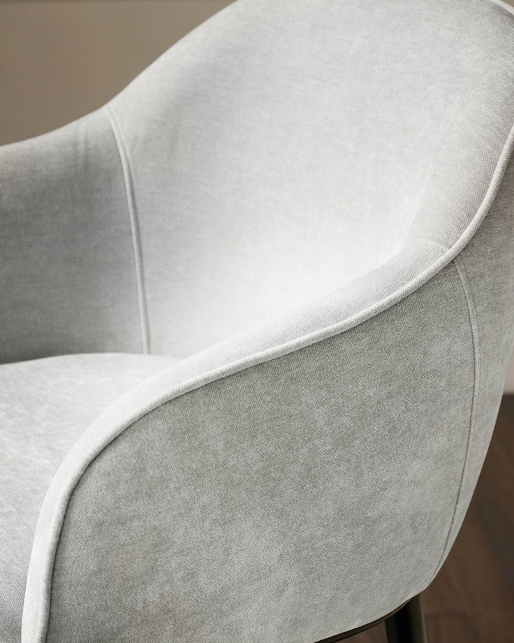 Harley bar stool in natural grey fabric, close-up detail of curved backrest and piping.