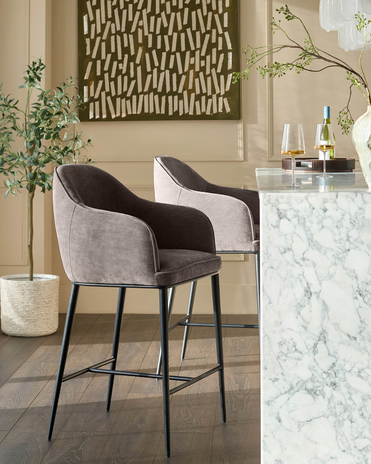Mocha fabric bar stool with curved backrest and black metal legs, shown in styled room setting.