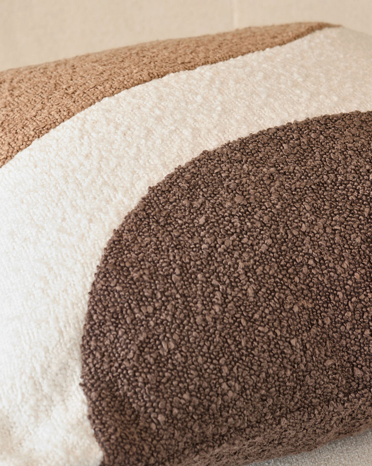 Harmony Cushion Medium in Natural, close-up showing layered neutral fabric textures in tan, cream, and brown tones.