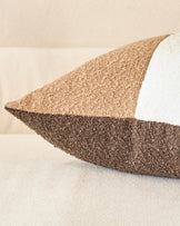 Harmony Cushion Medium in natural tones, showing layered textured fabrics in beige and brown with white piping detail.
