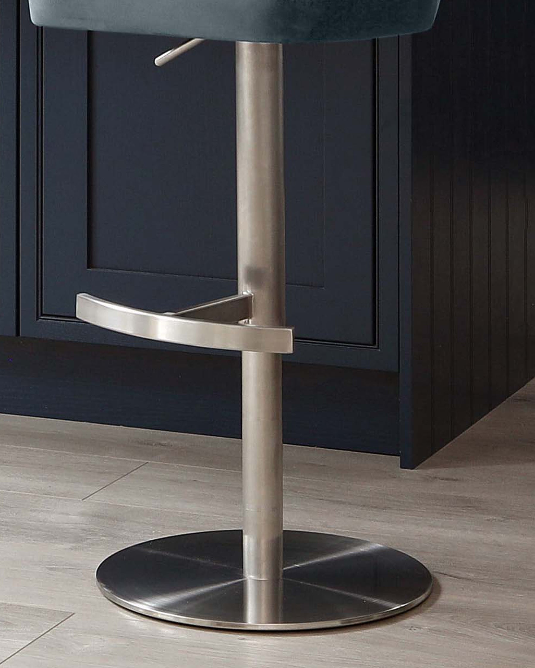 Harper velvet gas lift bar stool in blue-grey with brushed stainless steel base and curved footrest.
