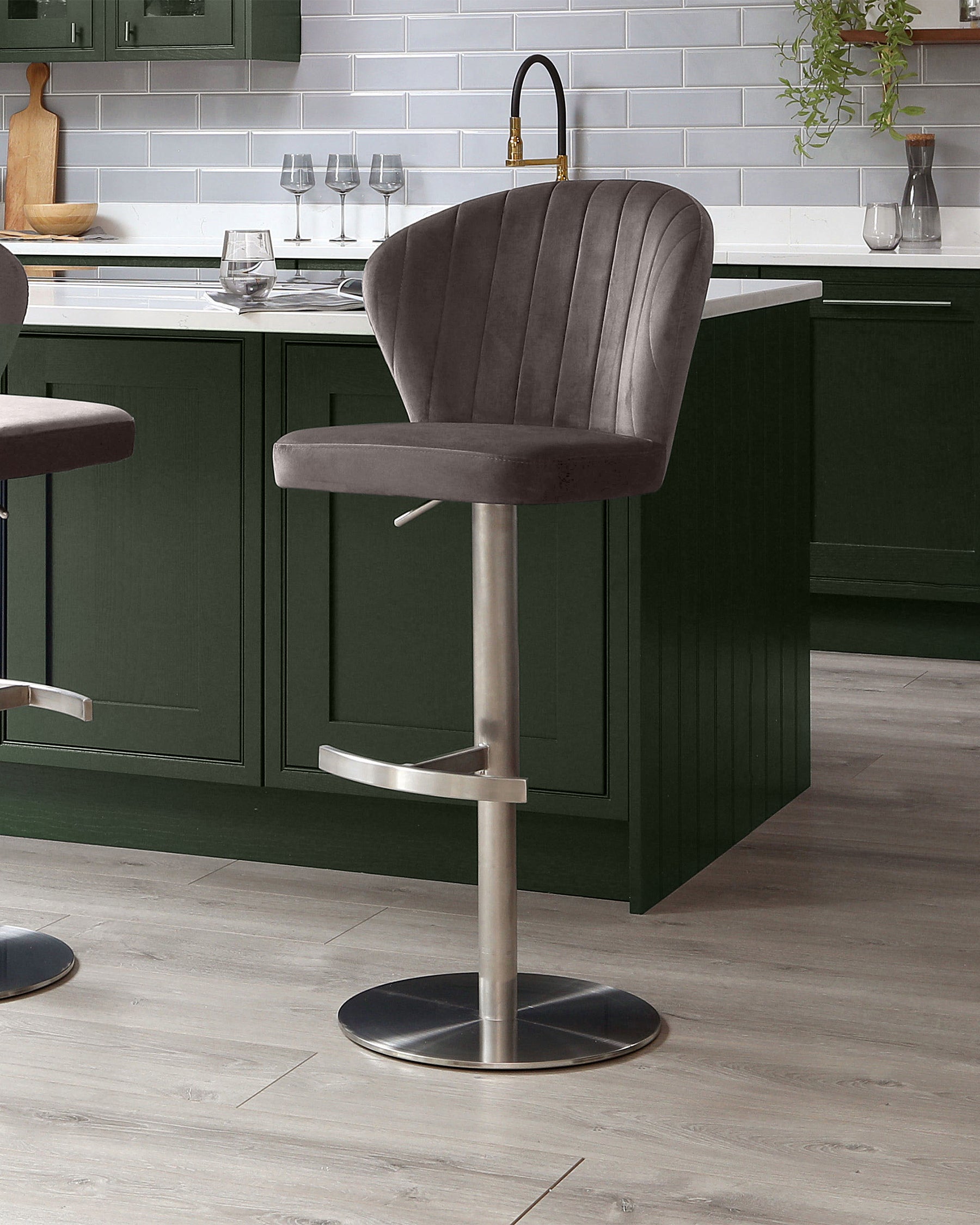 Harper mocha velvet gas lift bar stool with brushed metal base, shown at kitchen island with green cabinetry.