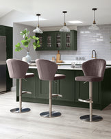 Harper velvet gas lift bar stool in mocha, shown in a modern kitchen setting at the island counter.