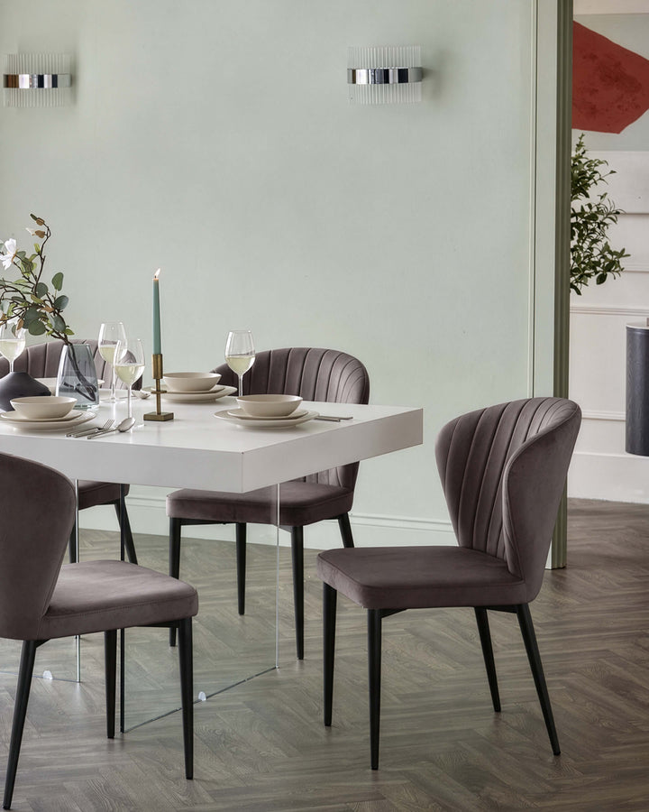 Harper dining chair in mocha velvet with black metal legs, shown at a dining table setting.