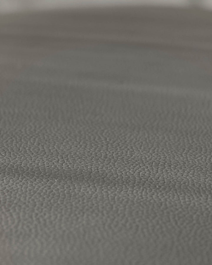 Close-up of grey textured furniture. Durable, stylish upholstery, perfect for modern homes.