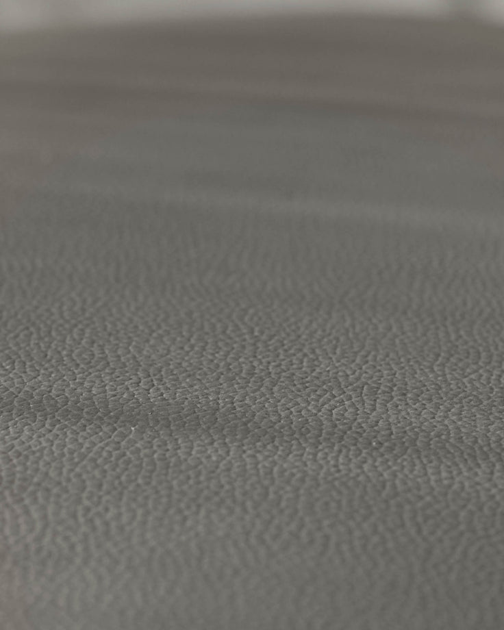 Close-up of grey textured furniture. Durable, stylish upholstery, perfect for modern homes.