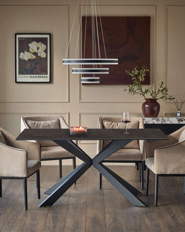 Hayden 6-seater dining table with dark grey ceramic top and black X-frame base in modern dining room setting.