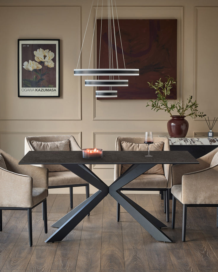 Hayden 6-seater dining table with dark grey ceramic top and black X-frame base in modern dining room setting.
