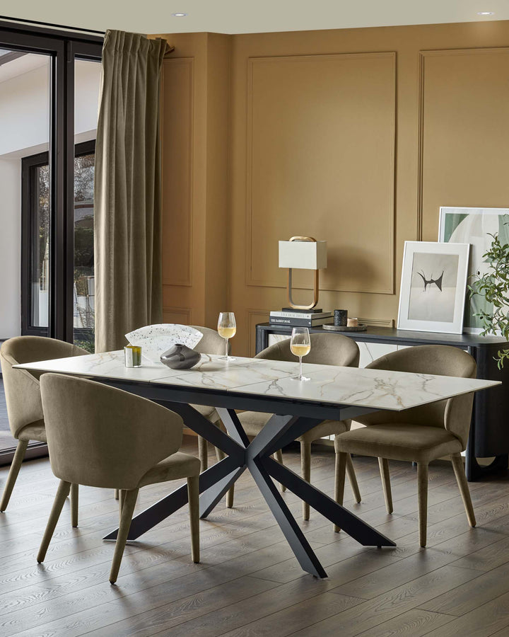 A contemporary dining set featuring a marble table with a black, geometric base and upholstered chairs, creating a stylish dining space.