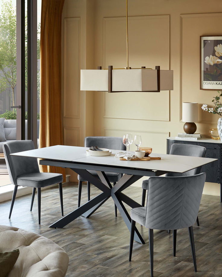 A dining room scene features a modern table and chairs, a sideboard, and an overhead light fixture.