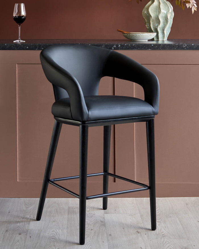 A stylish black leather bar stool with a sleek, minimalist design. Perfect for modern kitchens and bars.