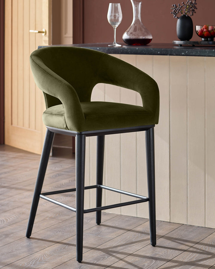 Olive green bar stool with black frame, upholstered with armrests, in a domestic setting.