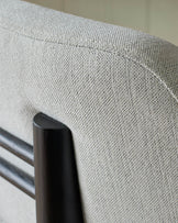 Henley bar stool in ivory fabric, close-up detail showing woven texture and black metal frame.