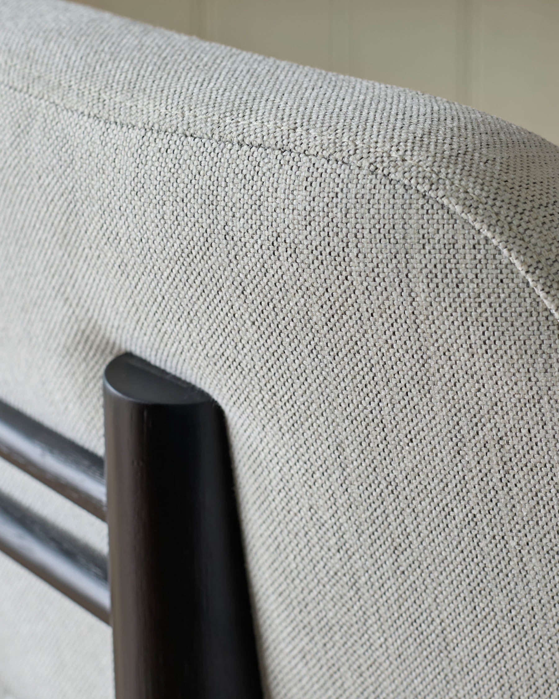 Henley bar stool in ivory fabric, close-up detail showing woven texture and black metal frame.
