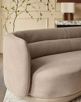 Henry 3-seater sofa in mocha fabric with curved arms and cylindrical back cushions, angled side view.