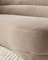 Henry 3-seater sofa in mocha fabric, curved design with stitched seams detail, close-up of seat cushion and armrest.