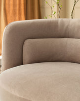 Henry 3-seater sofa in mocha fabric, curved armrest detail shown in close-up view with neutral room setting background.