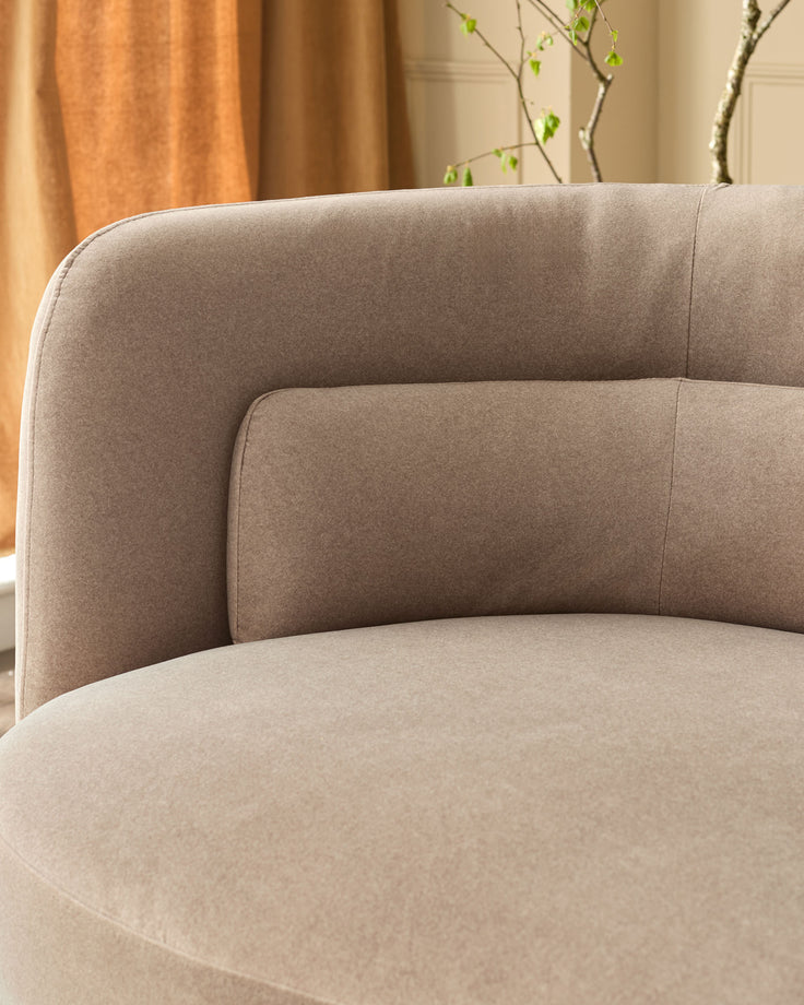 Henry 3-seater sofa in mocha fabric, curved armrest detail shown in close-up view with neutral room setting background.