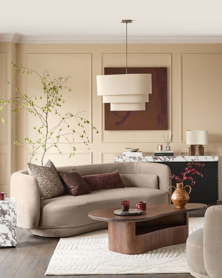 Henry 3-seater sofa in mocha fabric, curved design with rounded arms, styled in a contemporary living room setting.