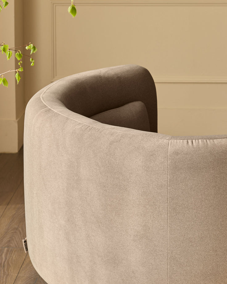 Henry Swivel Love Seat in mocha fabric, shown from rear angle displaying curved back and rounded armrest design.