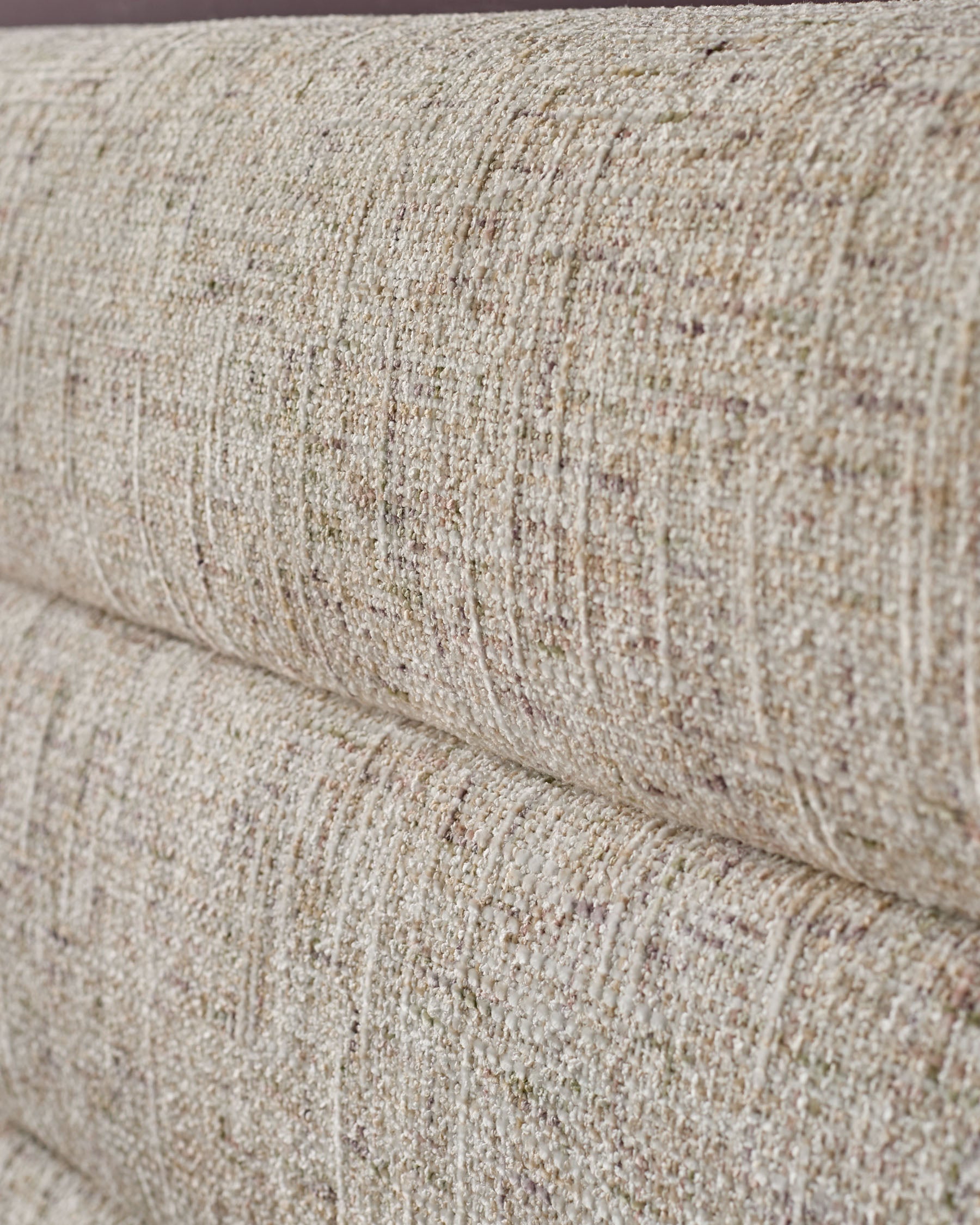 Close-up of natural beige textured fabric on Hepworth king-size ottoman bed, showing weave detail and stitching.