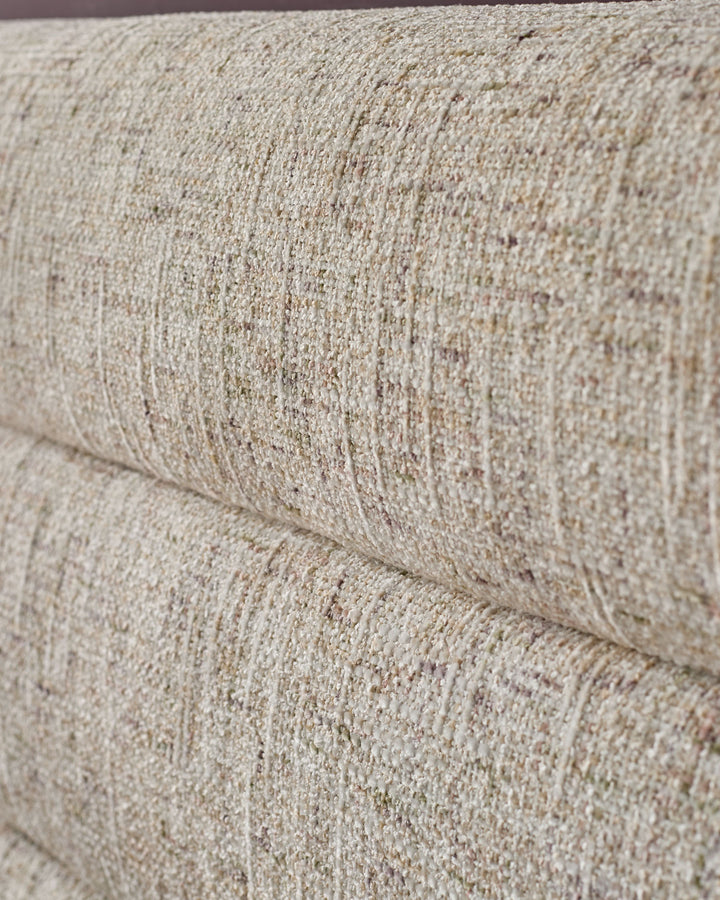 Close-up of natural beige textured fabric on Hepworth king-size ottoman bed, showing weave detail and stitching.