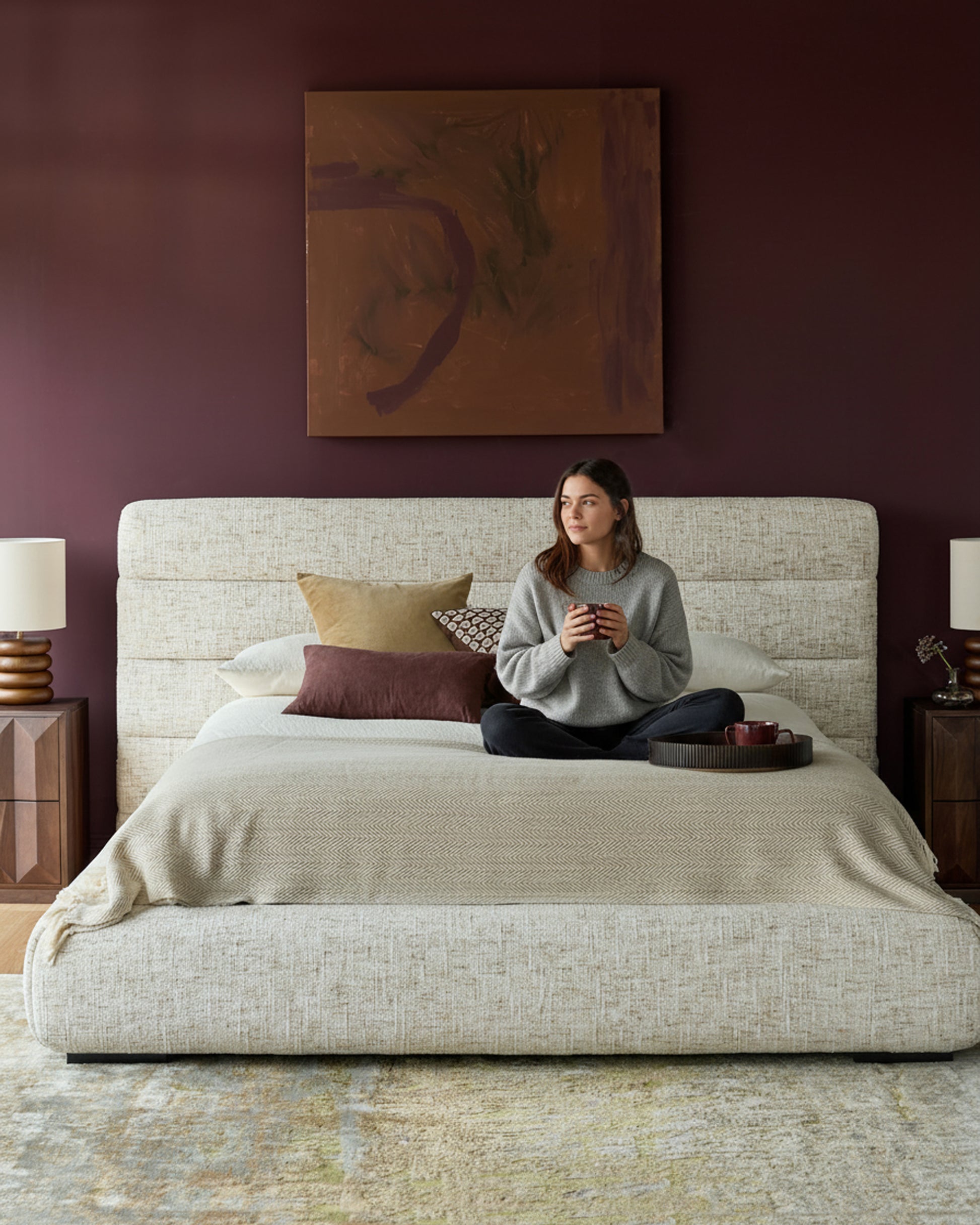 Hepworth King-Size Ottoman Bed in natural fabric, shown in a styled bedroom with coordinating pillows and bedding.