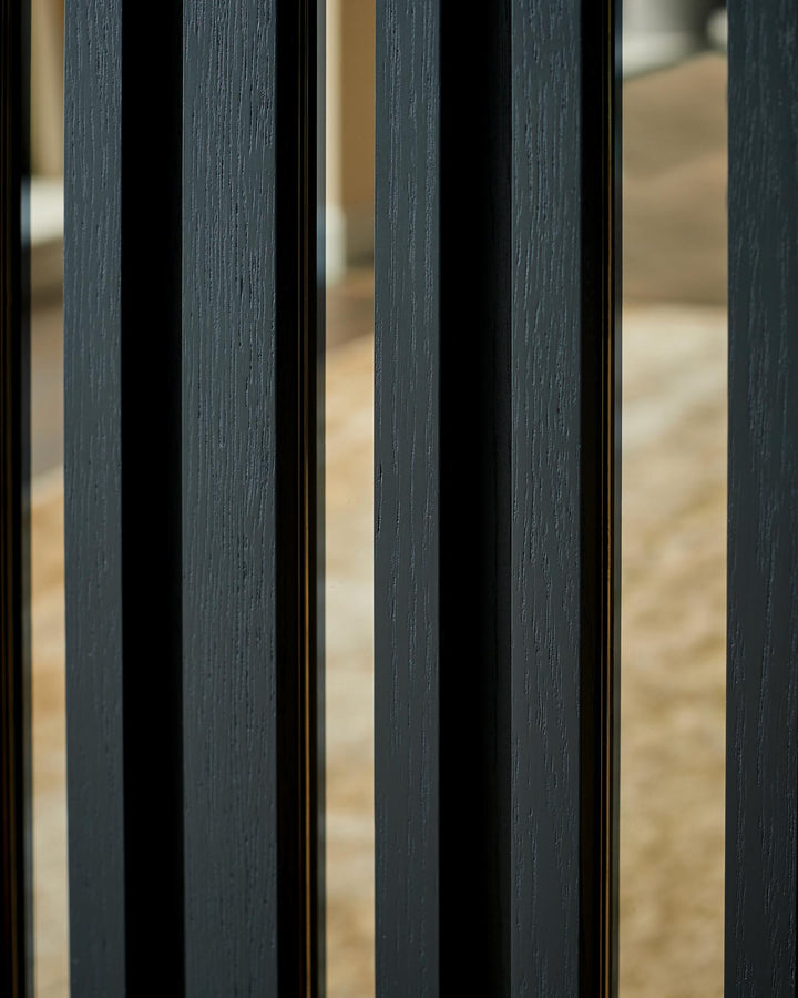 Close-up of a modern black wood slat design feature, showcasing the texture and contemporary style.