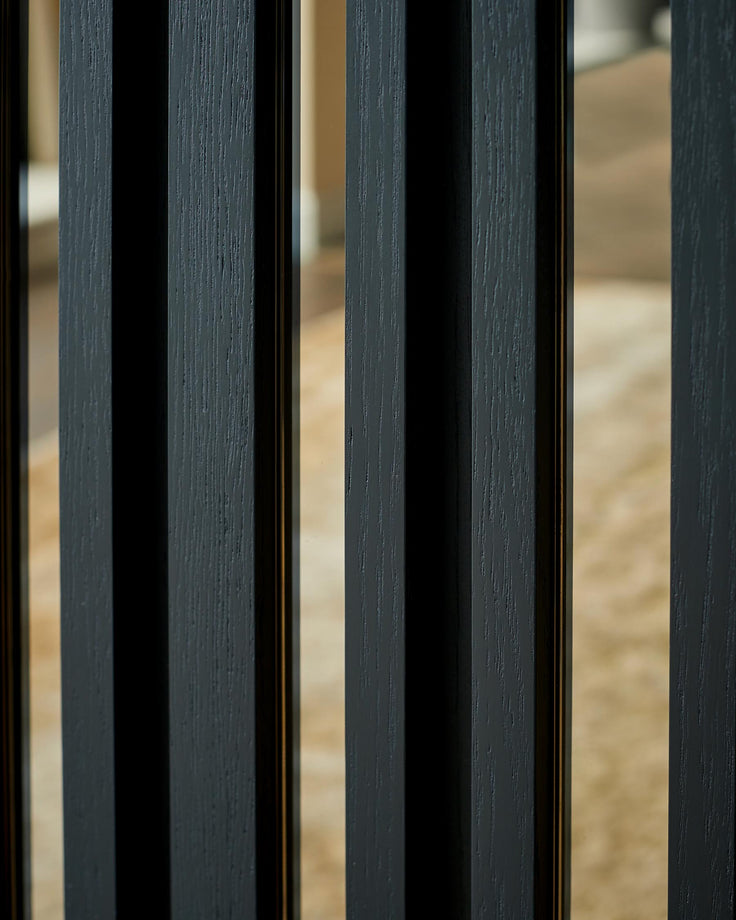 Close-up of a modern black wood slat design feature, showcasing the texture and contemporary style.