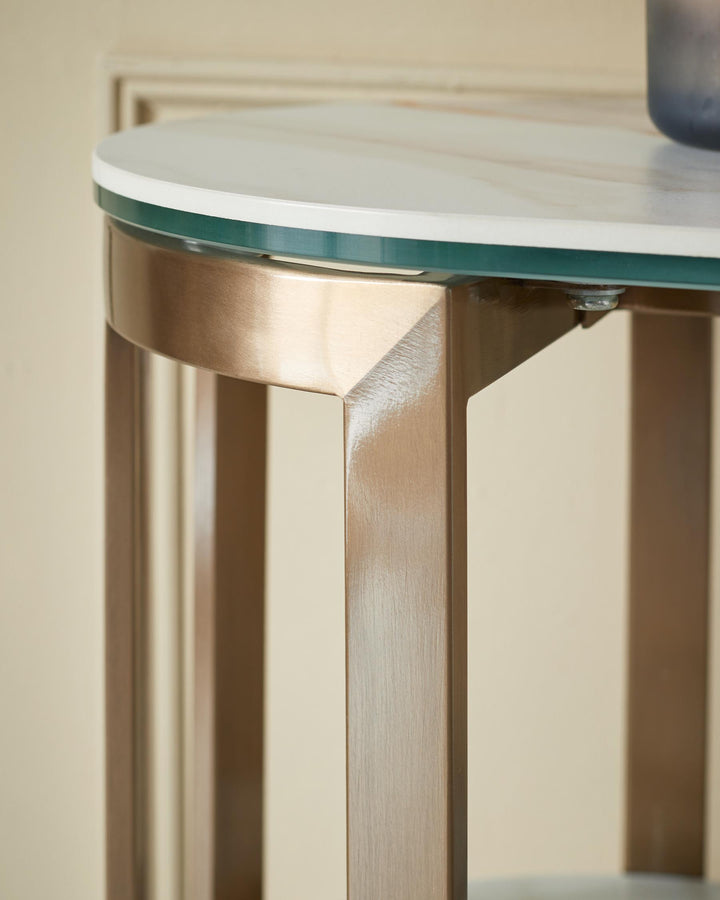 A stylish side table with a faux marble top and brass-effect metal frame, adding a touch of elegance to any room.