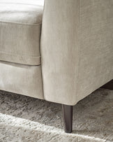 Light grey fabric 3-seater sofa detail showing tapered leg and textured upholstery close-up.