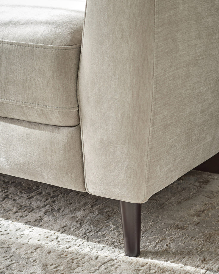 Light grey fabric 3-seater sofa detail showing tapered leg and textured upholstery close-up.