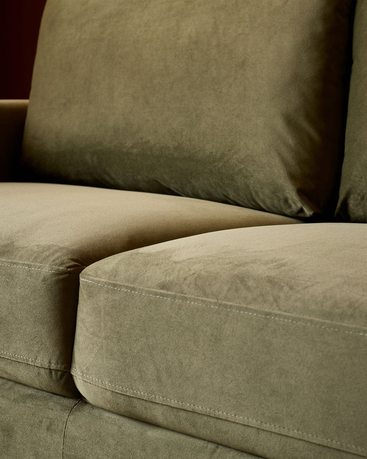 Jacob 3-seater sofa in olive green velvet, close-up of seat cushion and stitching detail.
