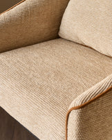 Julep bar stool in honey fabric, close-up view showing textured weave and wooden armrest detail.