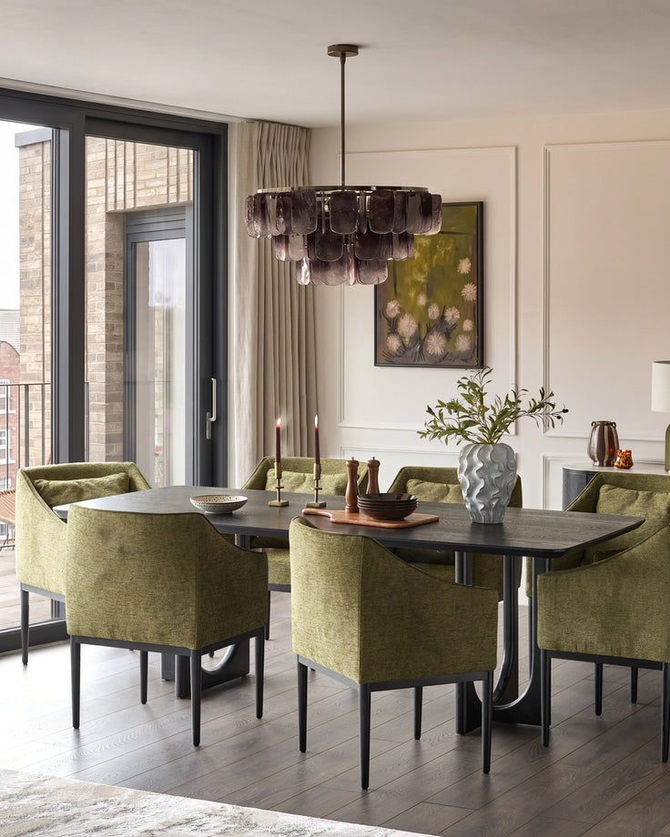 Olive green upholstered dining chair with black legs, shown at modern dining table in contemporary room setting.