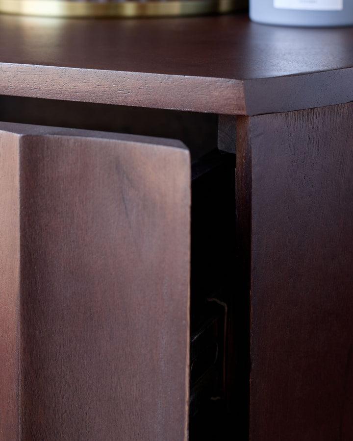 Dark mango wood bedside table with close-up of corner edge and leg detail, showing rich finish.