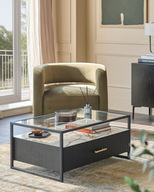 A modern living room setup with a stylish coffee table, plush green armchair, and dark wood cabinet.