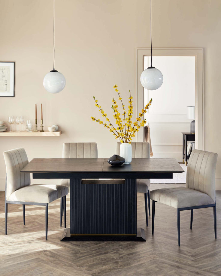 A dining table set with upholstered chairs and globe lighting, creating a modern and stylish dining space.