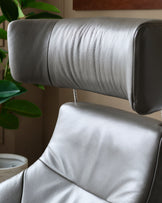 Karma dark grey leather swivel recliner accent chair and footstool