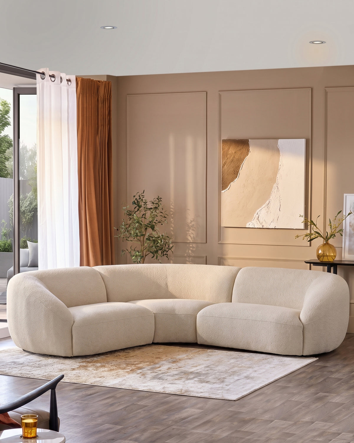Kimberley square corner sofa in natural fabric, curved design in beige living room setting.