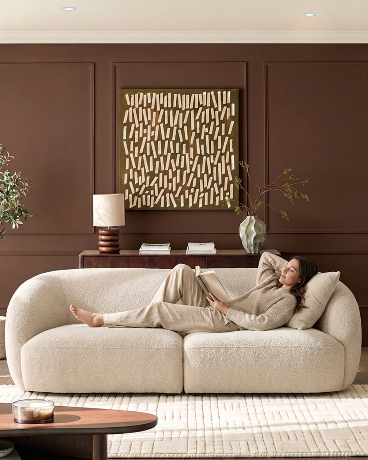 Kimberley 3-seater sofa in natural fabric with curved arms, displayed in a styled living room setting.