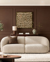 Kimberley 3-seater sofa in natural fabric with curved, rounded arms and modular design, styled in a modern living room.