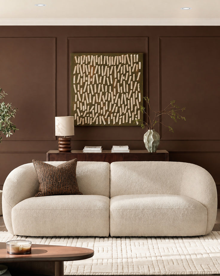 Kimberley 3-seater sofa in natural fabric with curved, rounded arms and modular design, styled in a modern living room.
