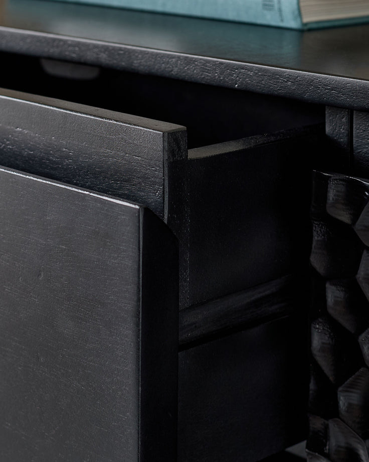 Knox large sideboard in black wood, shown at an angle with an open drawer revealing interior storage space.