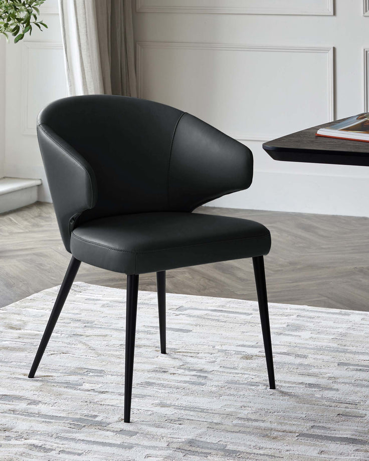 Black leather dining chair with curved backrest and black metal legs, shown in modern office setting.