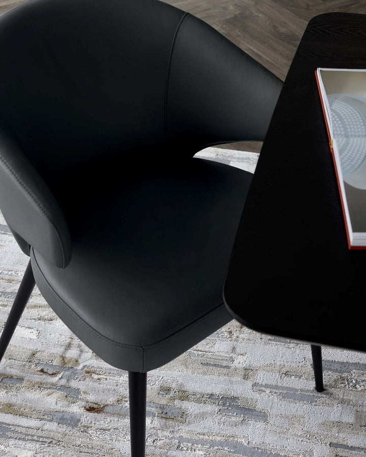 Black leather dining chair with curved backrest and armrests, angled side view showing seat and legs.