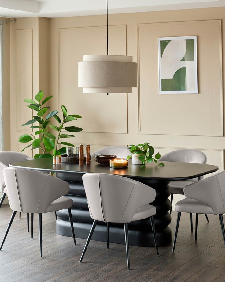 Landon light grey leather dining chair with curved backrest and black metal legs, shown in modern dining room setting.